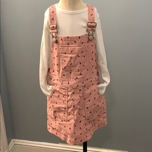 Overall dress with white long sleeve t-shirt